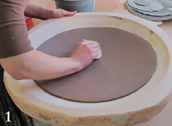 Cut the bowl bottoms using tar paper templates. Smooth and compress the largest slab into the plaster slump mold.