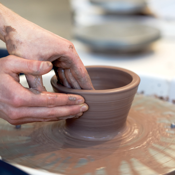 1 Center a ball of clay and open the form. Shape the bowl with a series of pulls.