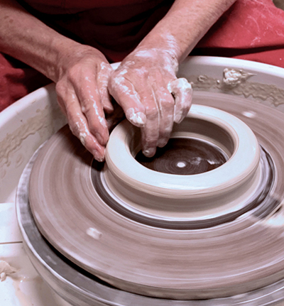 1 Throw a bottomless form by opening the clay on the wheel head.