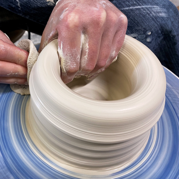 1 When centering and opening the clay, keep your elbows against your body to provide support from your core.