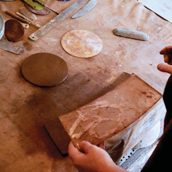 1 Cut the slabs for the circular base and conical body using templates.