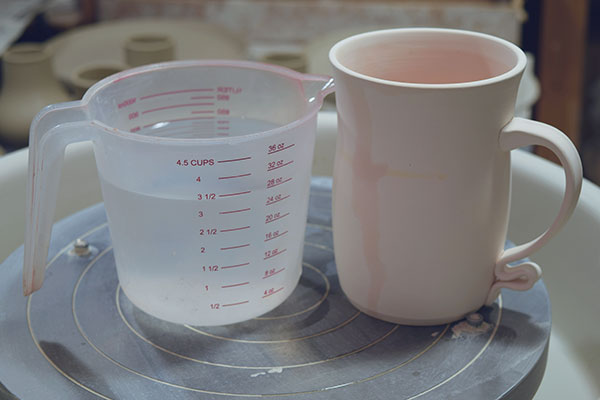 2 This bisque-fired mug holds 28 oz. of liquid. Multiply 28 × 0.824 to find it will hold 23 oz. after it is glazed fired.