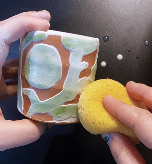 3 Wipe the surface gently with a wet sponge, rinsing it every couple of wipes.