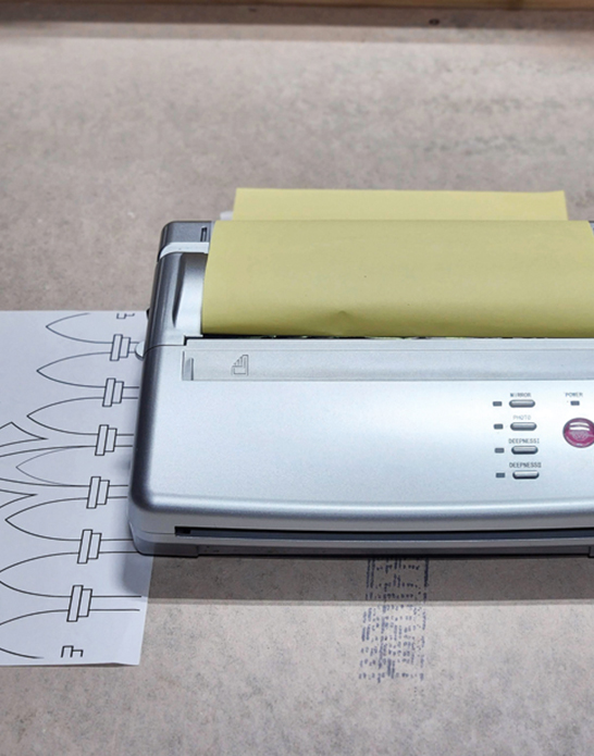 1 Use a thermal printer to make a transfer with cleaner, crisper lines in the design.