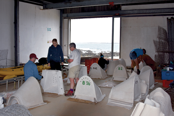 3 The two-piece nests are assembled in the boat house after delivery by boat or plane. 