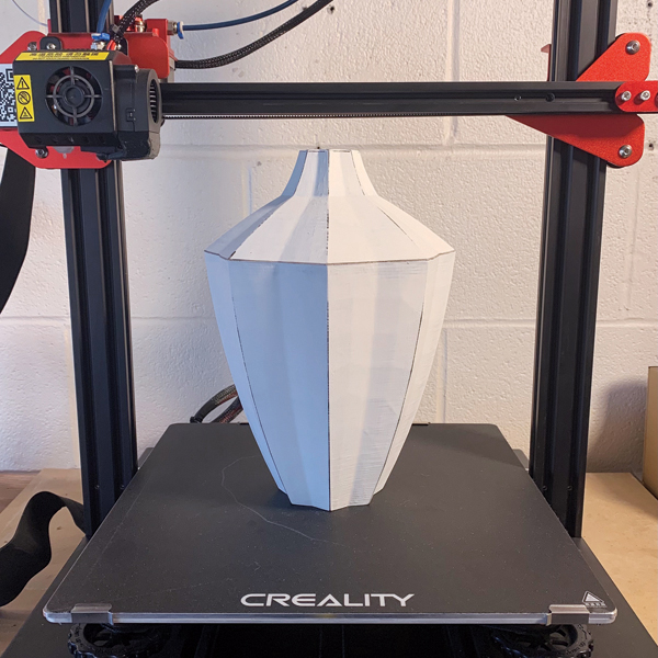 3 A Creality CR-10 Pro printer 3D prints the prototype in PLA filament.