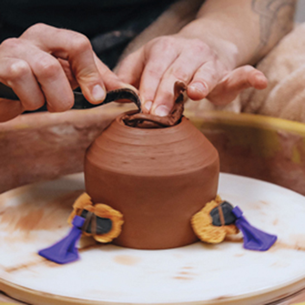 D When the mug reaches leather hard, trim a foot ring into the bottom of the form. 