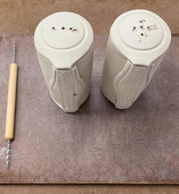 7 Use a small drill bit to make the holes for the salt and pepper in the tops of the shakers.