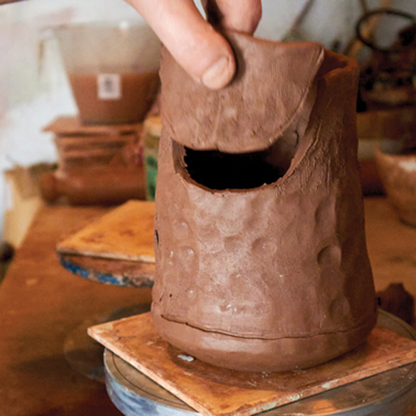 11 Cut out a section of the jug to add the throat/spout.