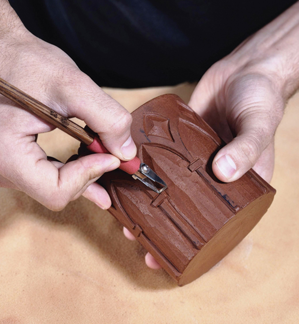 8 Carve the relief areas with a curved square-tipped carving tool.