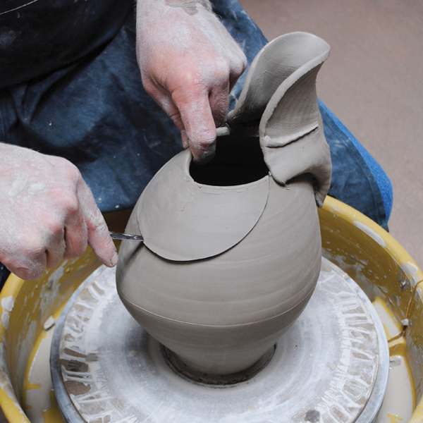 10 Cut a semicircular shape from the back of the pitcher to complement the spout shape and gesture.