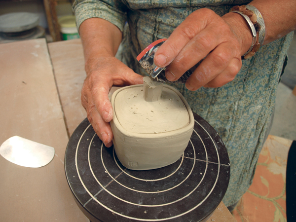 11 After the bisque firing, use graphic art tape as a resist for the glaze.