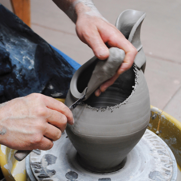 12 Add two pulled clay coils to the cut edge to create a finished rim.