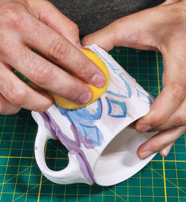 12 Wipe away the underglaze, leaving it only in the carved areas.