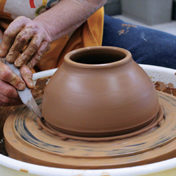 12 Smooth the exterior, compress the rim, then trim the exterior and wire the bowl from the bat.