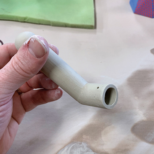 12 Refine and smooth both cut ends using the wet canvas table. Attach it to the cup.