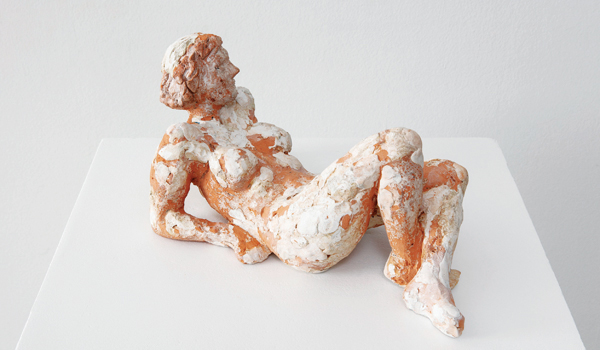 1 Frances Reclining, 15 in. (37 cm) in length, natural clay, epoxy clay, dairy milk, 2019. 