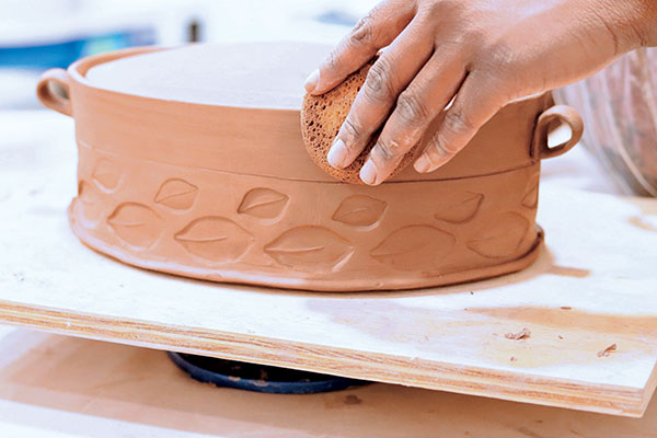 14 Further refine the casserole dish and clean up the edges using a damp sponge.