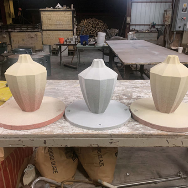 16 Spray the vases with glaze to achieve a subtle gradient.