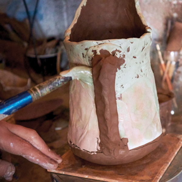 19 Apply slip to the main body of the jug. I like to use bright contrasting colors on this area.