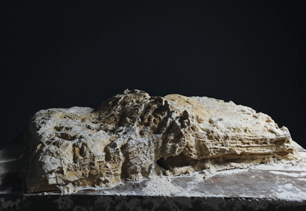 7 Vlad Basarab, The Archaeology of Memory_Large Book, 3 ft. 7 in. (1 m) in length, unfired white clay, video, 2014.