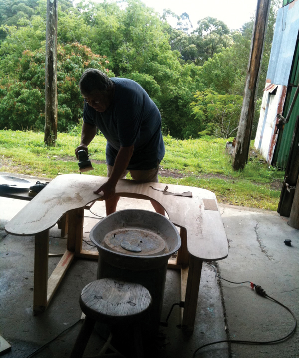 3 Sand the edges and top of the plywood with an electric belt sander. 