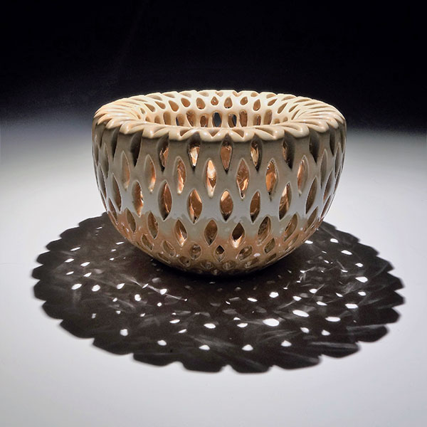 Double-walled bowl, 4½ in. (12 cm) in height, wheel-thrown and pierced white stoneware with glaze, fired to cone 7 in reduction, 2020. 