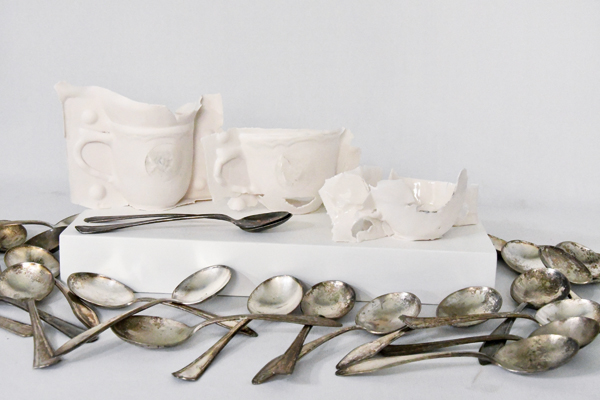 7 Chapman’s Losing My Thirst for Living teacups paired with Athens Lunatic Asylum cutlery. 