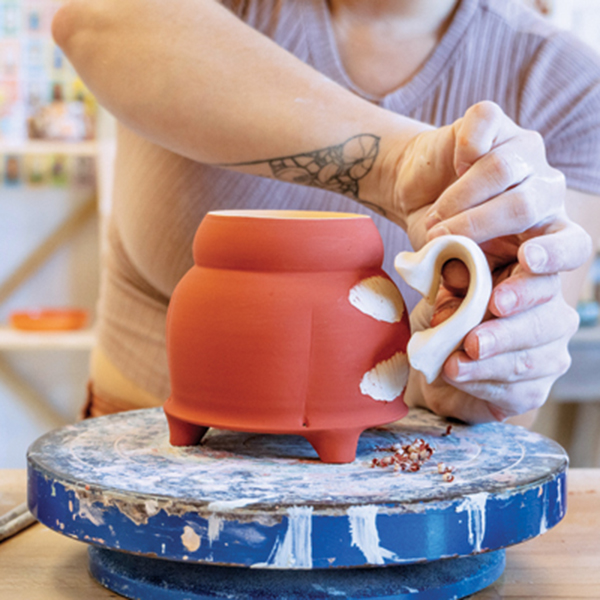 5 Attach the handle to the body of the form. Be sure to scrape away excess underglaze at the attachment point.