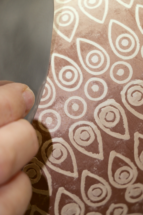 3 Transfer patterns onto the piece using a needle tool with a rounded tip.