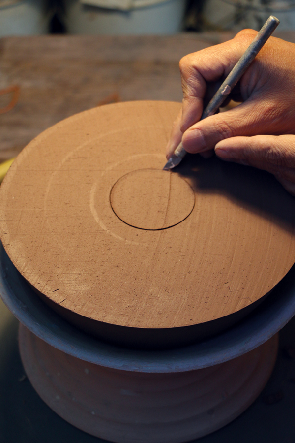 9 Use an X-Acto knife to release and remove the center disc of clay covering the inner bowl.