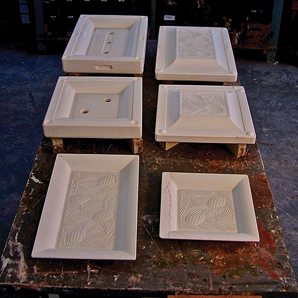 3 Models and solid-cast molds that Dan Mehlman made for two large platters with relief decoration. Note that these molds were used in a factory to solid cast a few first samples. Subsequently, the same models were used to make RAM press dies for production (Rookwood Pottery for Mottahedeh). 