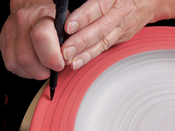 2 Draw concentric guide lines on the underglazed areas using a water-based marker. A pencil will repel underglaze.