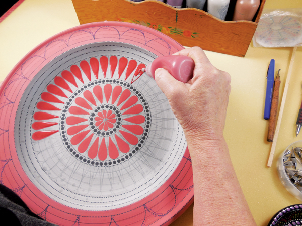 8 Outline the teardrops, then fill them in with underglaze. A larger tip can be used for filling in larger areas.