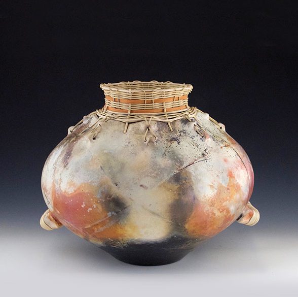 7 Kota Osa (basket-rim jug), 20 in. (51 cm) in diameter, wheel-thrown raku clay, burnished, pit fired, reed and cane weaving, 2019.