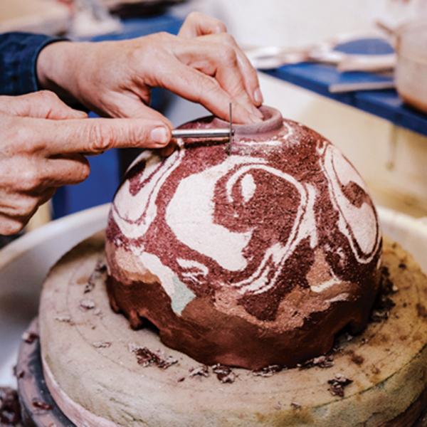 14 Trim the foot, then clean up the exterior of the leather-hard surface to reveal the marbled clay body.