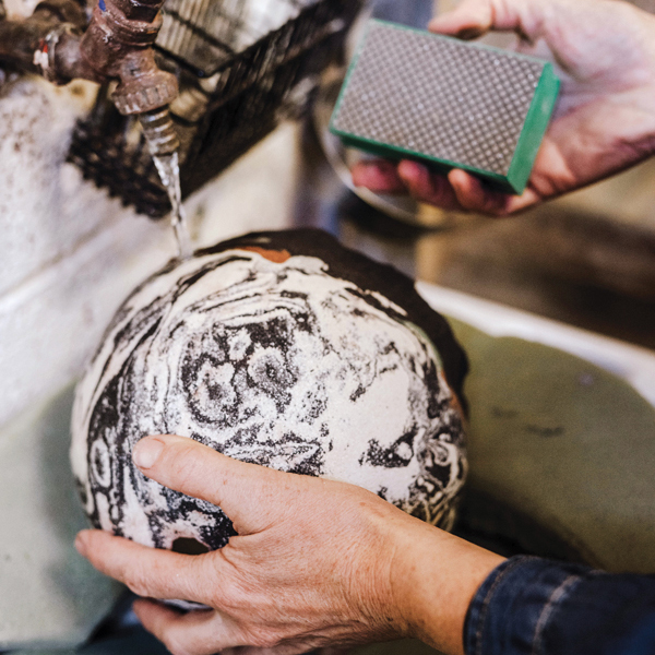 15 Once the piece is fired, use a diamond pad to clean the form and further reveal the surface pattern.