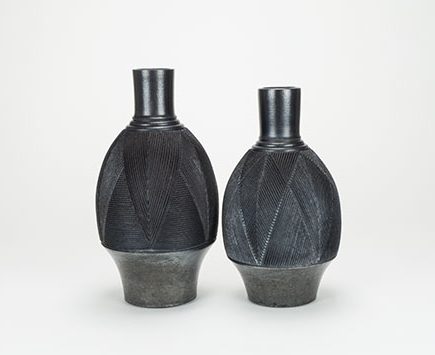 4 Bottles, to 10 in. (25 cm) in height, stoneware, terra sigillata, raku fired.