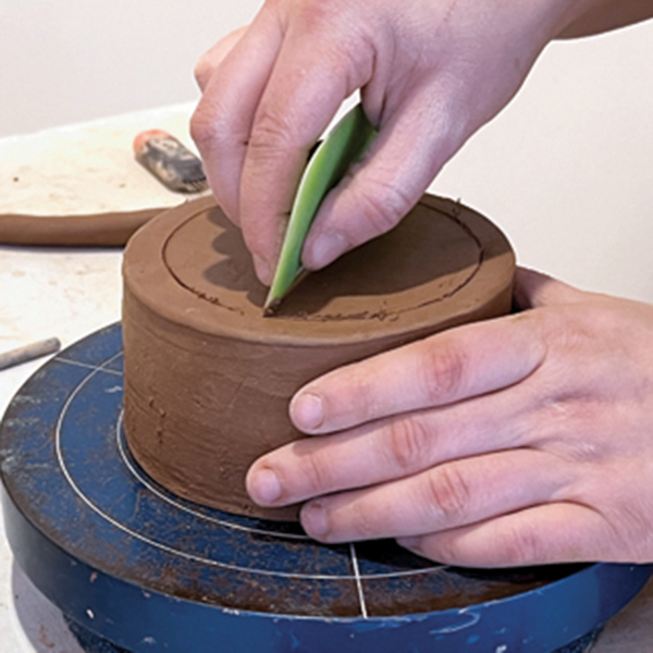 4 Draw a circle on the bottom where you will attach a coil foot for a locking mechanism so the sections of the jar will stay connected.