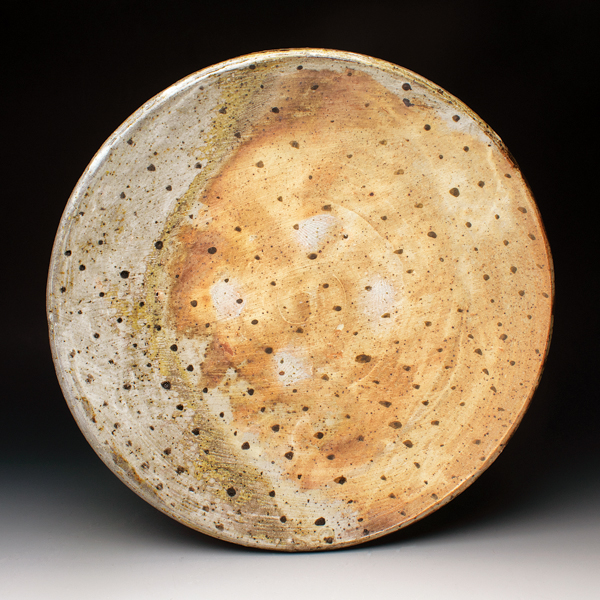 Plate, 9½ in. (24 cm) in diameter, iron-rich clay, slip, glaze.