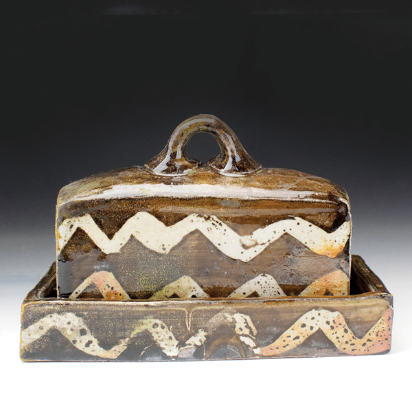 Butter dish, 6¼ in. (16 cm) in length, iron-rich clay, slip, glaze.