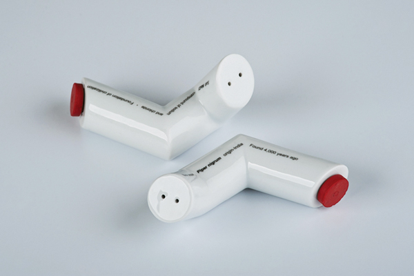 Salt and pepper shakers, 5 in. (13 cm) in height, porcelain, clear glaze, ceramic decals and silicon cork, designed by Marek Cecula with Dagmara Rogers, produced by Cmielów Design Studio, 1998. Photo: Sebastian Zimmer.