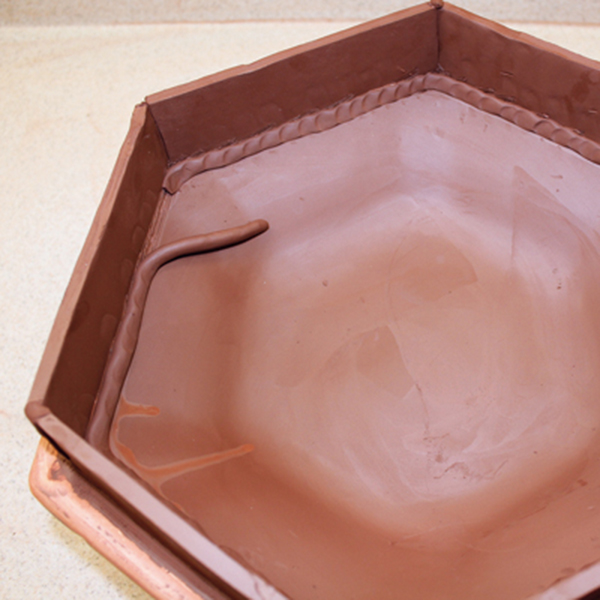 6 To create a deeper bowl, add slab sides to the top rim and reinforce all joins using soft, thin coils.