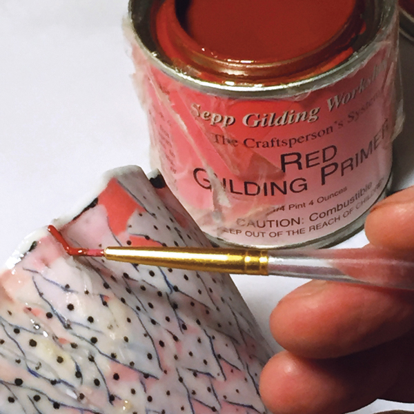 3 Apply red gilding primer onto the epoxied area, but not on the frisket.