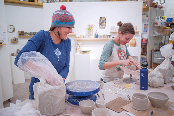 3 Students working in an introductory clay course, 2019. 