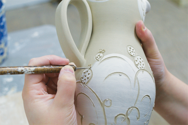10 Add outlines using a stylus for forms that will be accented with lusters or overglaze later.