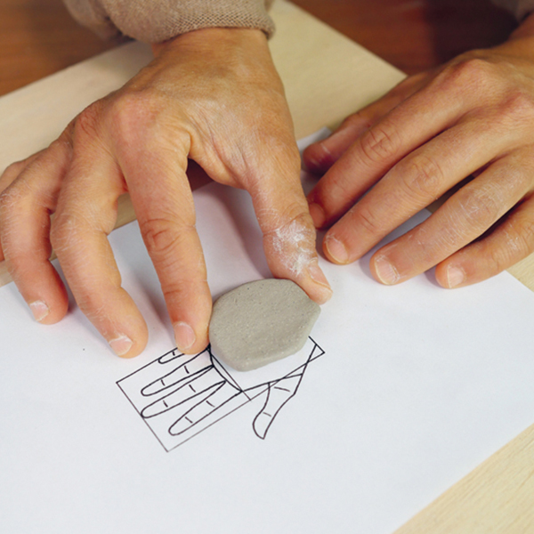 1 Cut a palm shape out of a ¼-inch-thick slab of clay. 