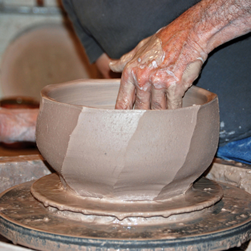4 After cutting diagonal facets, continue to shape the bowl with your inside hand while keeping distortion to a minimum.