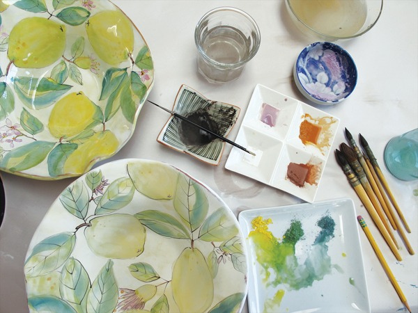 1 Mix stains on white plates. Group blues and reds to make shades of purples, and group yellows with blues and greens.