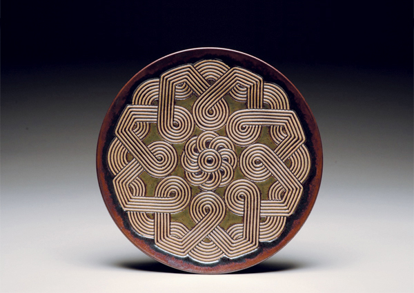 1 Plate, 23 in. (58 cm) in diameter, carved stoneware, 2010. Photo: John Dowling.